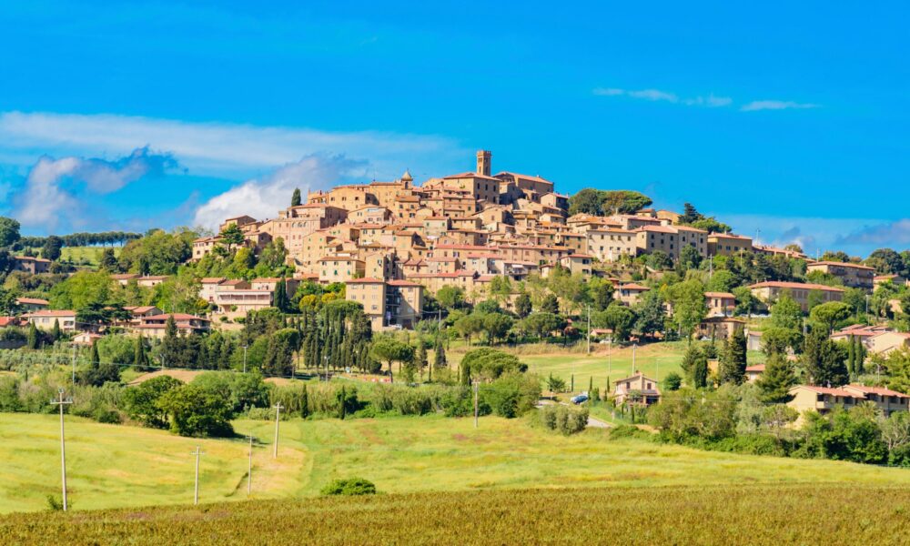 Tuscan countryside between ancient villages and green hills, in